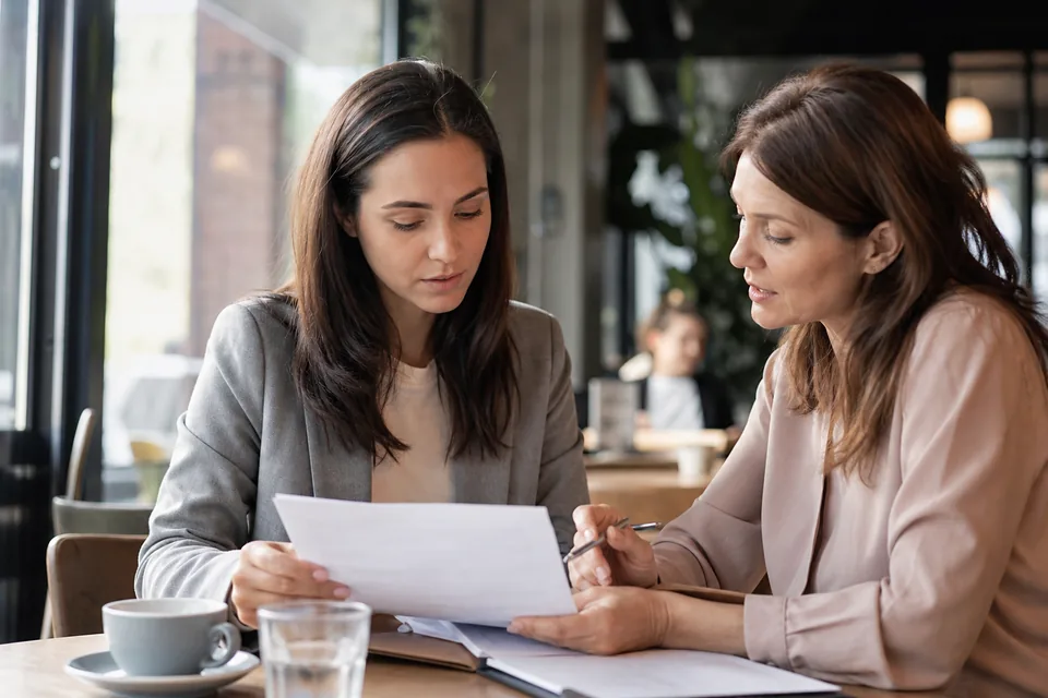 Adult performer reviewing a contract with an agent